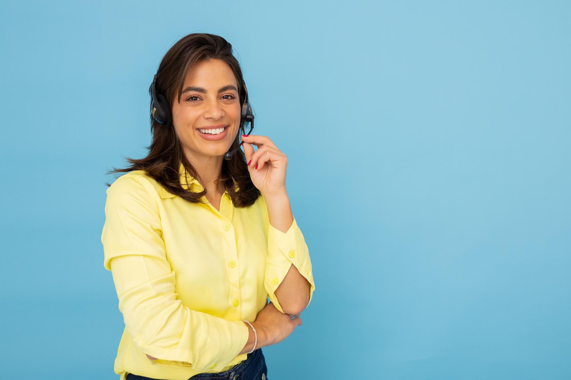Latina call center operator assisting customers with a headset