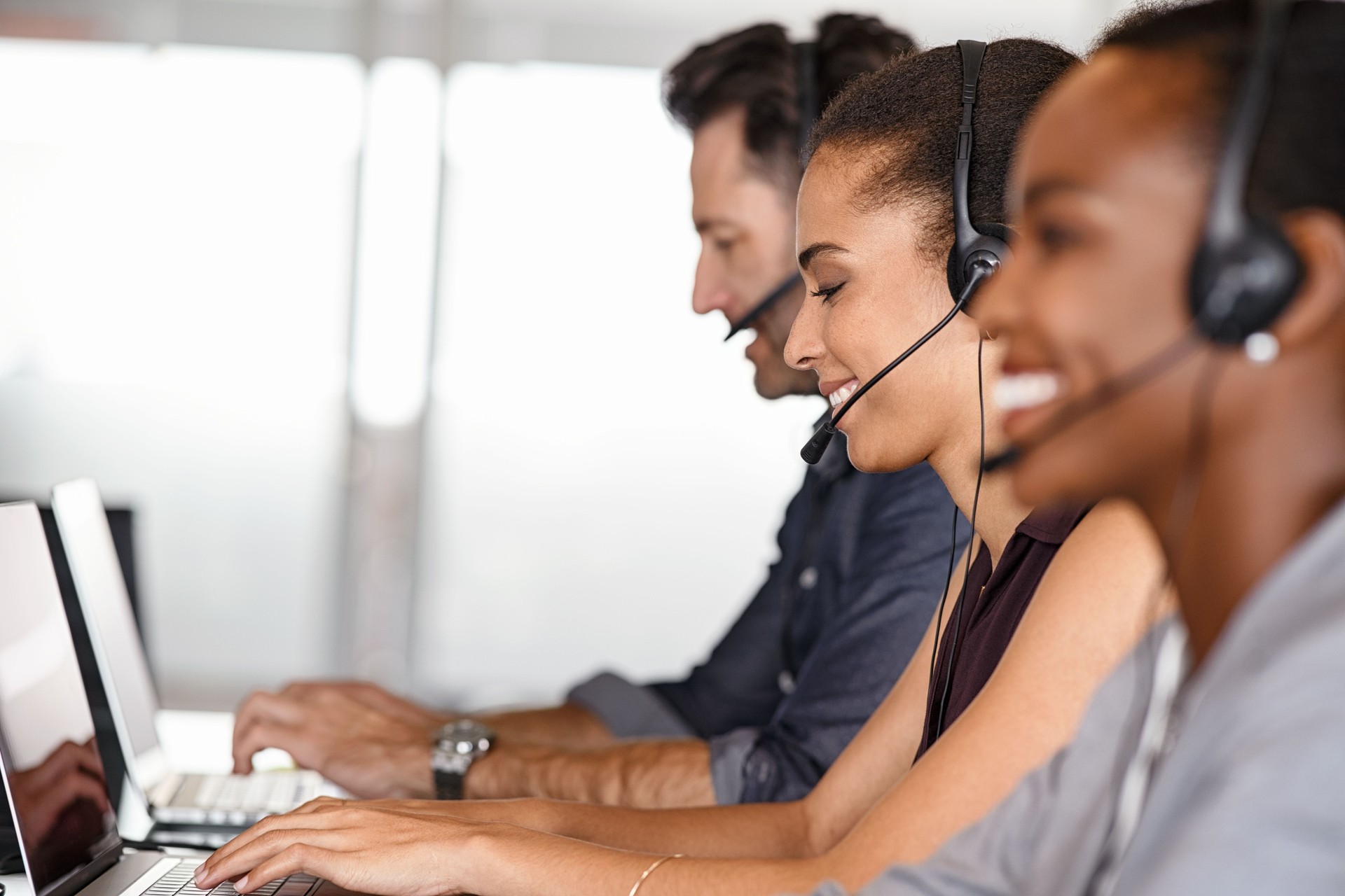 Team working on the modern headsets at work