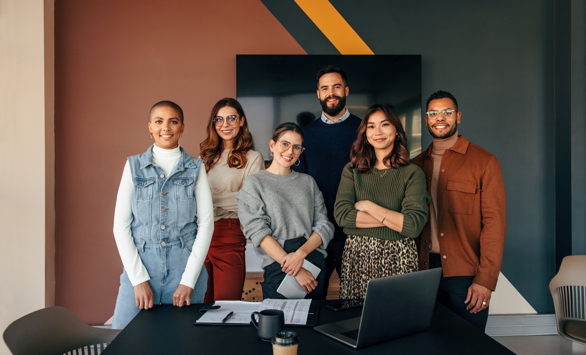 Successful business team standing in a boardroom