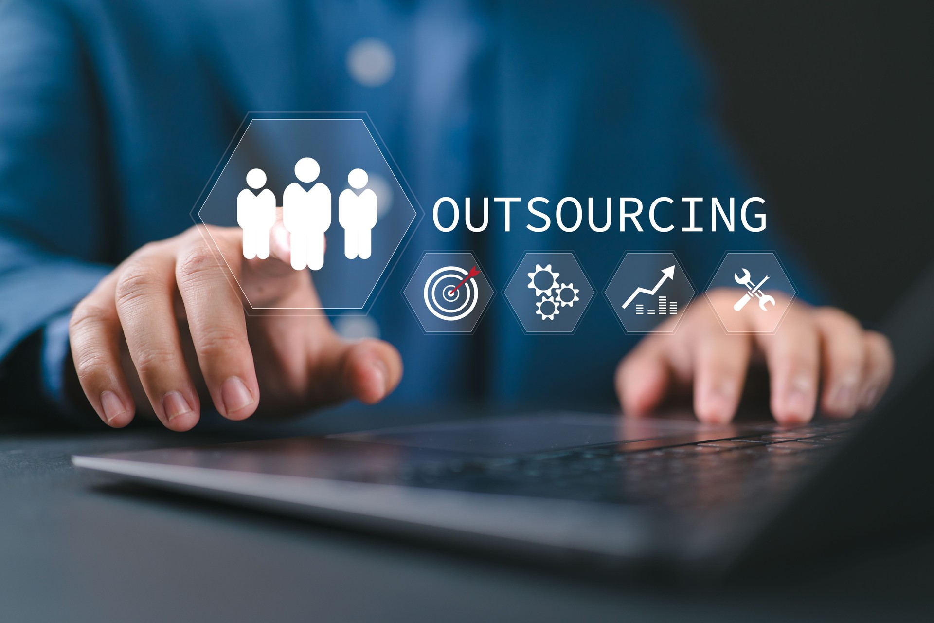 Outsourcing concept, Human resources and global recruitment. Businessman use laptop with outsourcing icon for business working and company.
