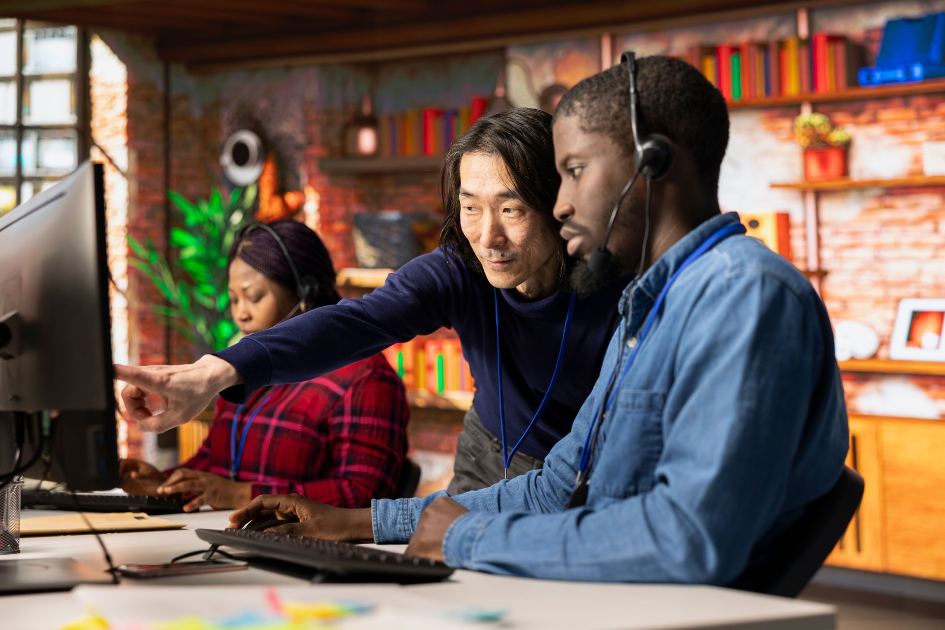 Call center senior manager providing guidance to multiethnic team