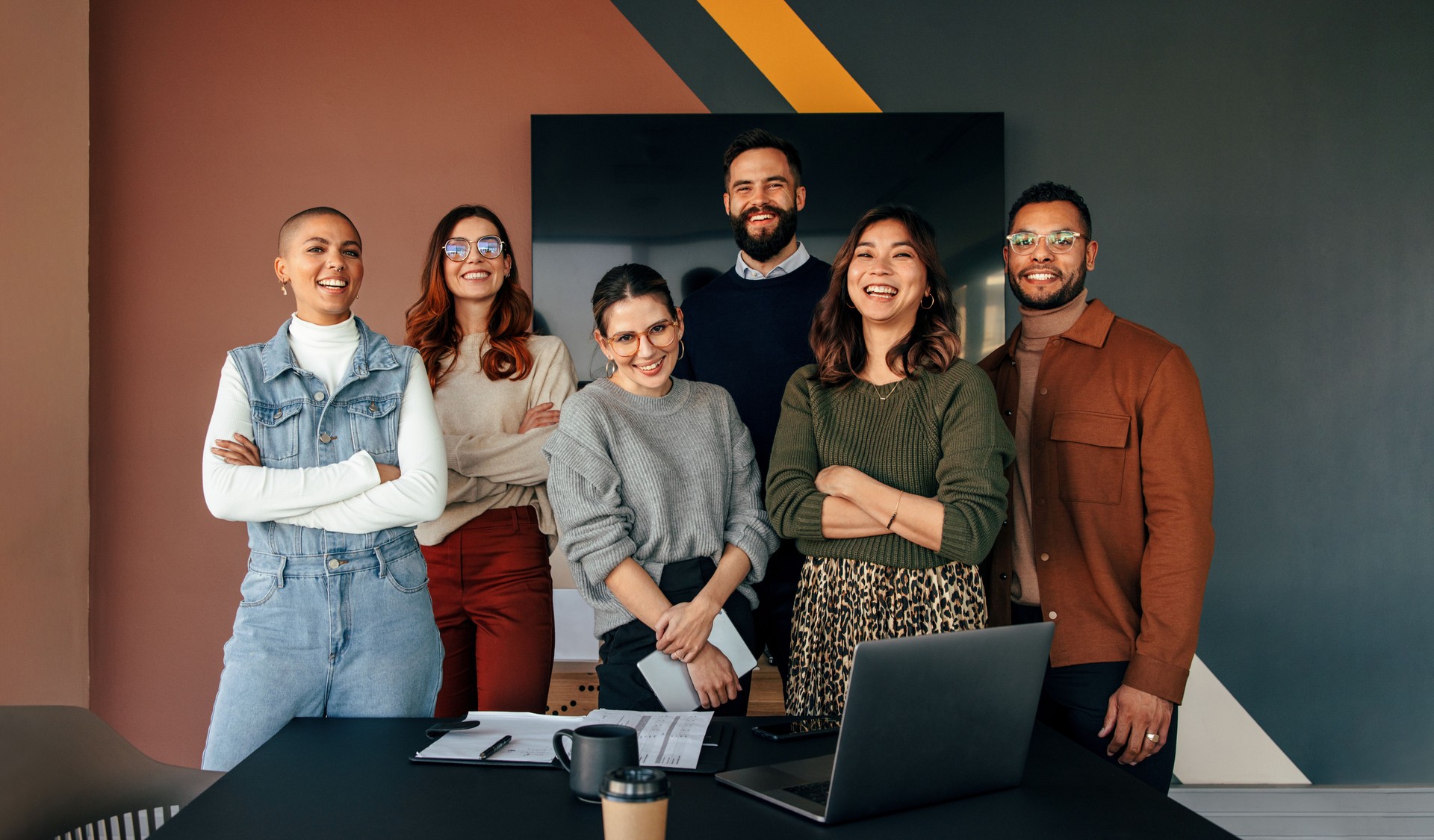 Multicultural business team standing in a boardroom